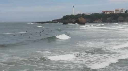 Surfers riding a solid swell at Biarritz, France.